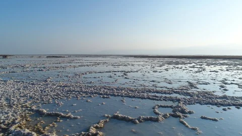 Low flying drone shot over the salt formation of the Dead Sea. DJI_0038-01 Stock Footage 104496957
