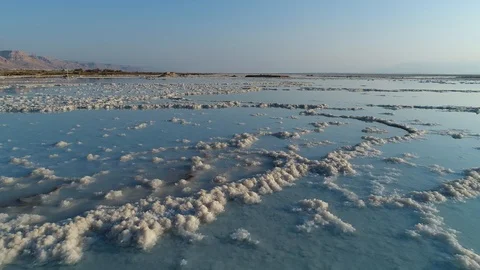 Low flying drone shot over the salt formation of the Dead Sea. DJI_0038-02 Video stock 104496965