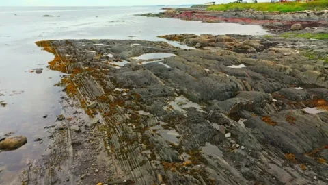 Low-flying drone video during low tide of the St-Lawrence River showing the.. 動画素材 236342883