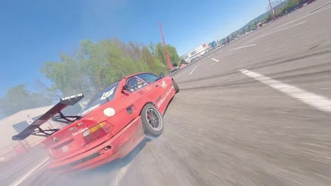 Low Flying FPV Drift Battle With Close Ground Perspective Stock Footage 328469661