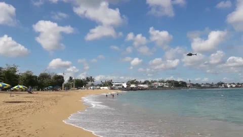 Low Flying Helicopter Hovering Near The Beach Shore Stock Footage 218253767