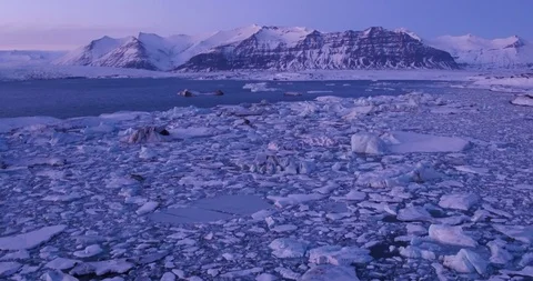 Low flying over glacier lagoon in Iceland at sunset, global warming Stock Footage 108453518