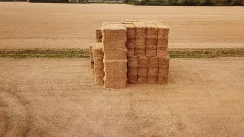 Low flying over haystack Stock Footage 94670656