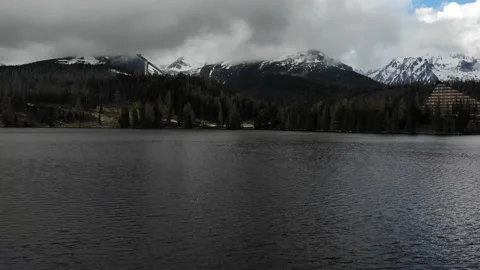 Low flying over a mountain lake view from a drone Stock Footage 237284949