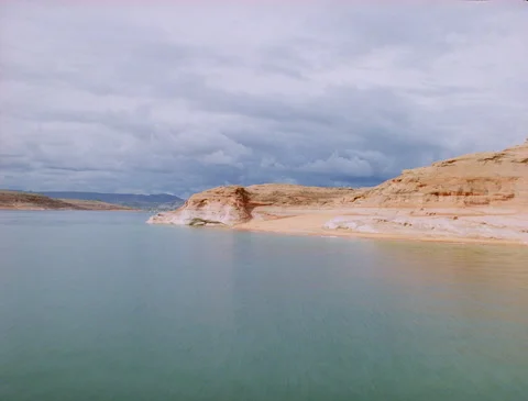 Low flying over red Lake Powell rock formation Stock Footage 136074527