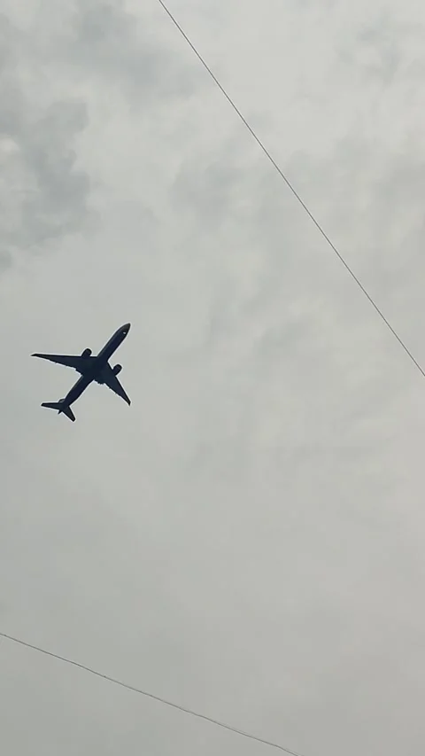 Low-flying plane in the sky Stock Footage 324611247