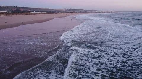 Low Flying Shot of the Waves during Sunset at Costa da Caparica beach, Portugal Video stock 145560767