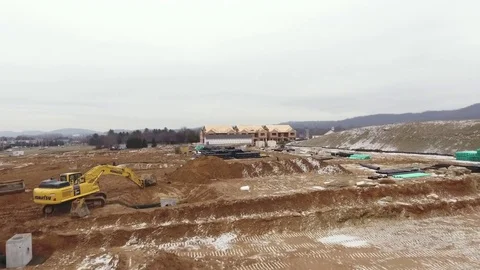 Low flyover home construction site in winter Stock Footage 71697637