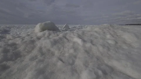 Low flyover ice chunks on frozen lake Stock Footage 82974358