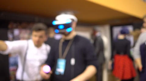 Low focused.Young manin Virtual Reality Glasses. VR. Belarussian comic con. Stock-Footage 68981255