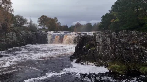 Low Force waterfall Teesdale, Durham, England, autumnal drone footage Stock Footage 264092983