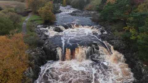 Low Force waterfall Teesdale, Durham, England, autumnal drone footage Stock Footage 264093002