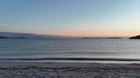 Low Forward Drone Flight from Beach Toward Sunset Sea in Sardegna Vídeo Stock 332940583