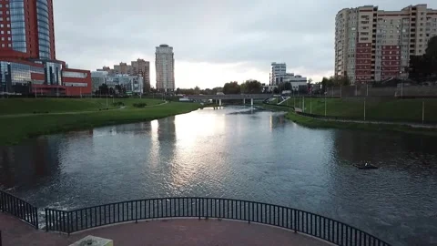 Low forward drone flight over urban river Video stock 324635135