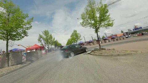 Low FPV Chase of Black BMW Compact During Qualifying Run Stock Footage 322972152