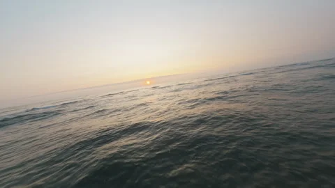 Low FPV Drone Flight Over Sandy Beach Waves at Sunset in Portugal Stock Footage 327441828