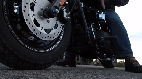 Low front angle of motorcycle going into gear and taking off Stock-Footage 47351875