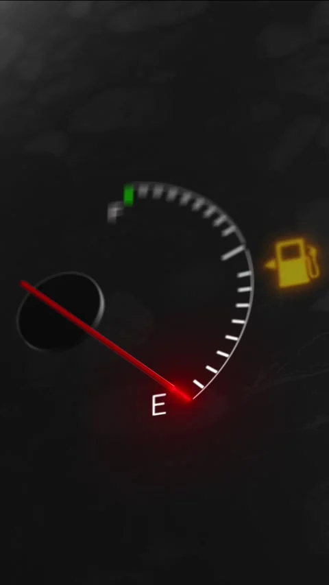 Low fuel dashboard indicator visual dark speedometer style, red pointer, and glo Stock Footage 340571715