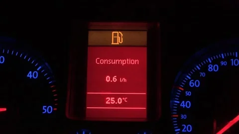 Low fuel warning light glowing on a digital car dashboard. Instrument cluster Stock Footage 341805616