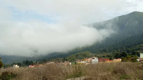 Low-hanging clouds on a mountain slope Stock Footage 71434649