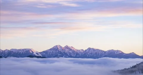 Low inversion clouds moving in alpine valley Stock Footage 166880496