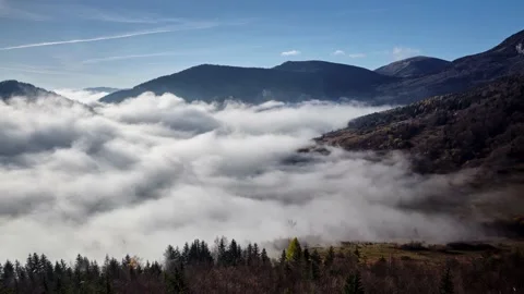 Low inversion clouds. Rural mountain landscape in the beautiful nature of the Stock Footage 221016467