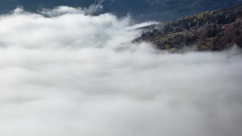 Low inversion clouds. Rural mountain landscape on the edge of the forest in Stock Footage 221016509