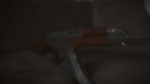 Low key footage of AK-47 Kalashnikov rifle. Stock Footage 95889618