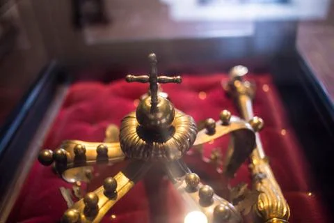 Low key image of beautiful queen/king Luxury crown golden jewelry on  red sat Stock Photos