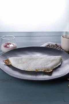 Low key Melted mozzarella cheese tapioca, next to a cup of black coffee blu.. Stock Photos
