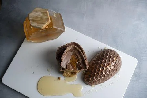 Low key Milk chocolate Easter egg filled with Brazilian honey cake 18. Stock Photos