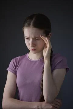 Low Key Studio Portrait Of Stressed Teenage Girl Worried About Mental Healt.. Foto stock