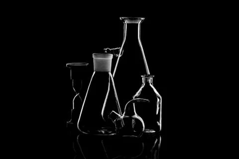 Low-key Studio Shot of a White silhouette of a chemical laboratory utensils l Stock Photos