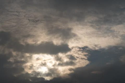 Low key sun through the sky Stock Photos