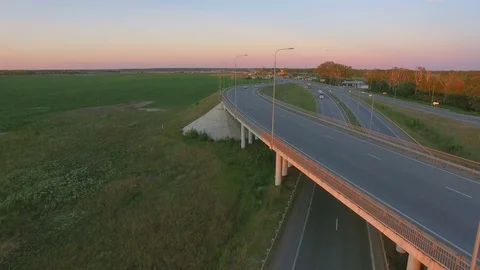 Low-level aerial perspective of highway intersection Stock Footage 77490128