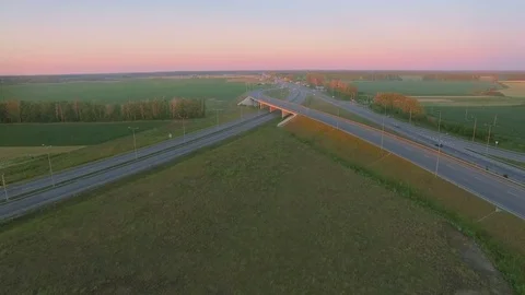 Low-level aerial perspective of highway intersection Stock Footage 77490199