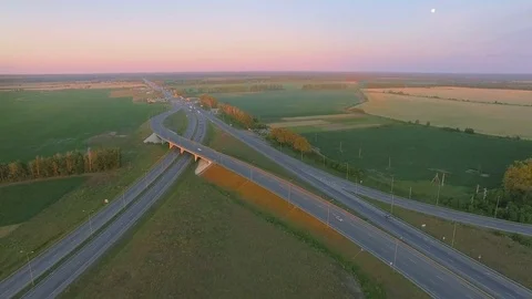 Low-level aerial perspective of highway intersection Stock Footage 77490515