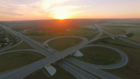 Low-level aerial perspective of highway intersection Stock Footage 77490577