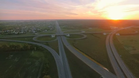 Low-level aerial perspective of highway intersection Stock Footage 77490668