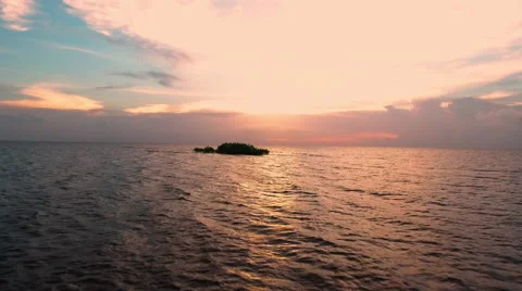 Low-level aerial view and flyby of small isolated island over South Florida. Stock Footage 64798641