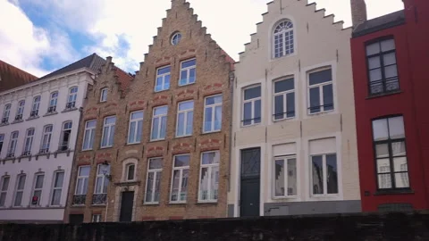Low level canal boat view of stepped gable houses, Bruges, Belgium Stock-Footage 290106122