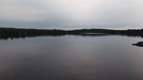 Low Level Drone Flight Over Calm Water at Dusk, Silver Lake, Ontario, Canada Stock Footage 342163576