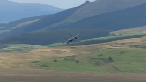 Low level F-15 Eagle military jet fighters Stock Footage 88299091