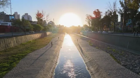 Low level flying above stonework water canal aerial dolly in shot toward Stock Footage 163265263