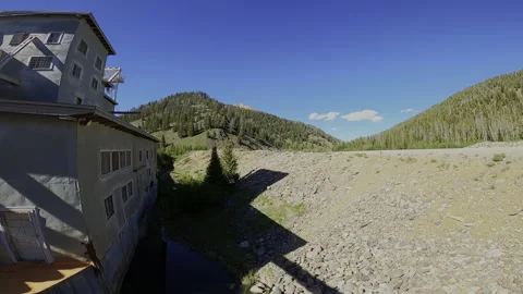 Low-Level FPV Flyby: Yankee Fork Gold Dredge – Profile View &amp; Industrial Scale Stock Footage 332131507