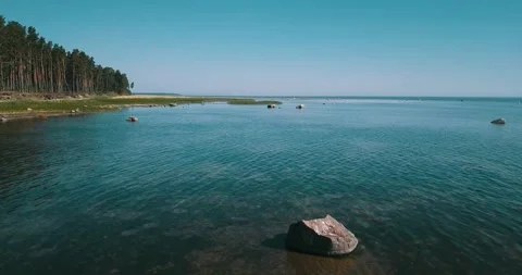 A low-level pass over the shallow water of the sea bay Stock Footage 146701169