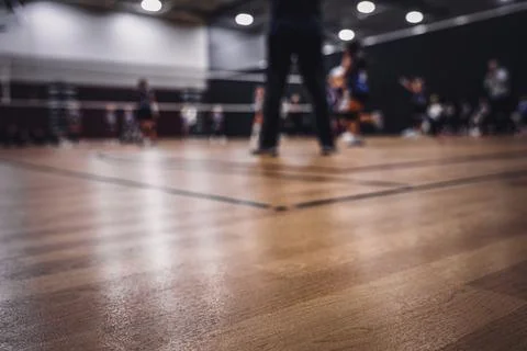 Low level selective focus on gym floor at a youth volleyball match Foto stock