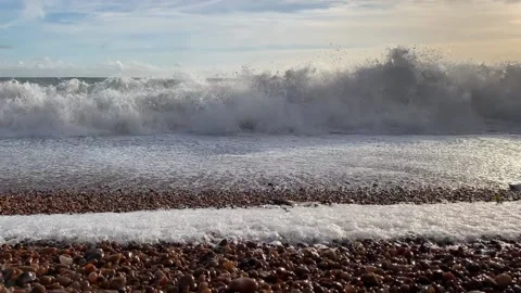 Low level shot of waves crashing on a beach. Stock-Footage 219854576