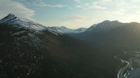 Low Light Mountain Scene with snow and blue sky, Drone Shot Stock Footage 289486031