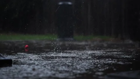 Low Light Slow Motion Rain Fall on Patio Stock Footage 149839450
